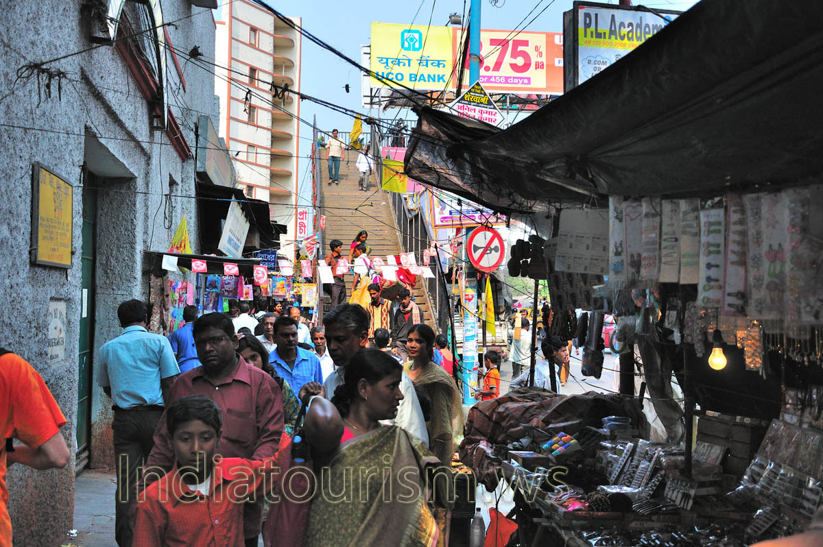 The street is full of advertising and sales shops