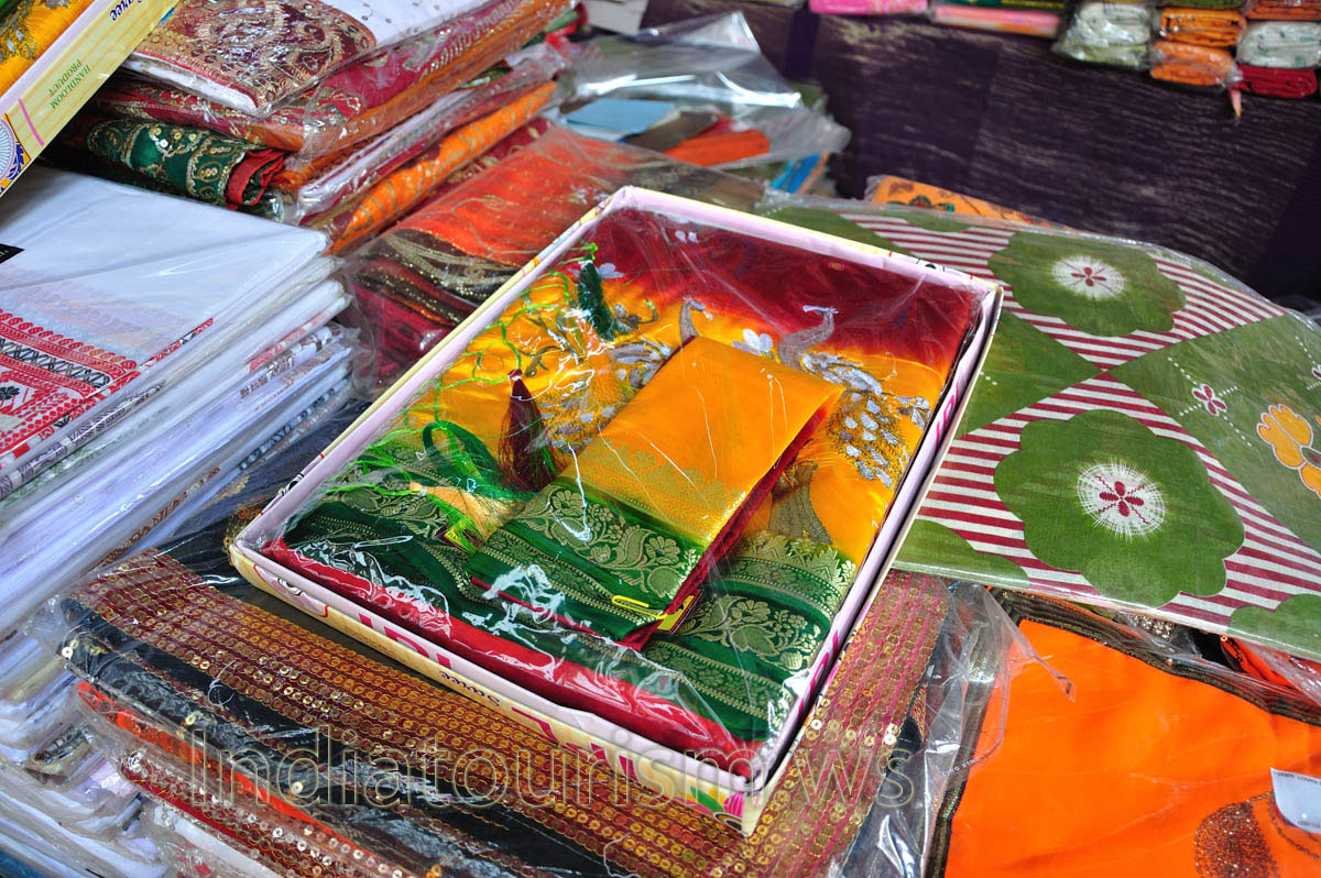 Colored sari with a picture of of white peacocks