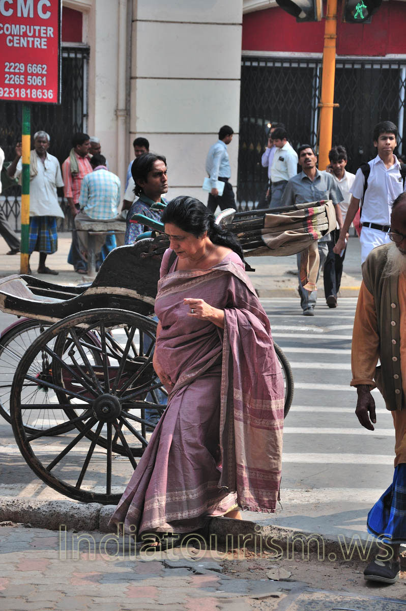 lady, dressed in a cherry-sari