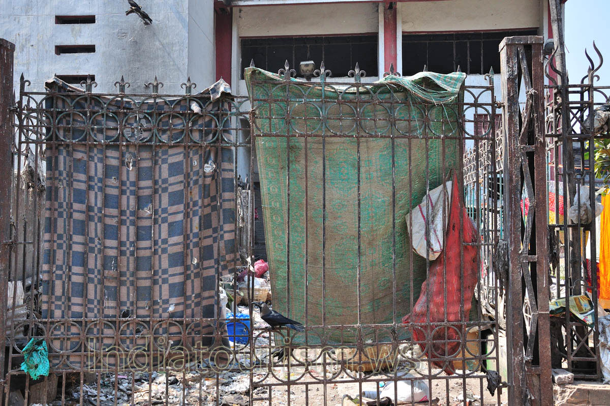 Poor people hang old cloths on the fence