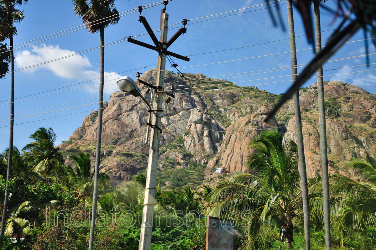 white house in the middle of Maruthuvazhmalai Hill