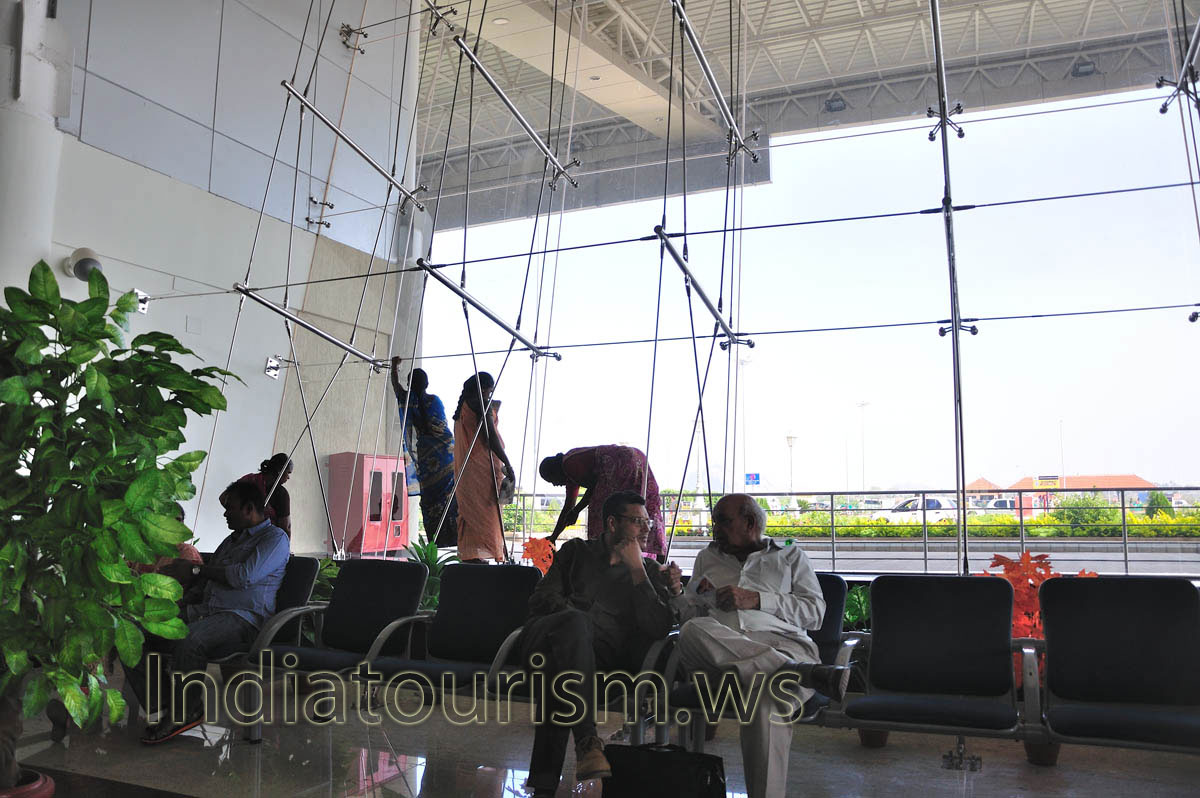 women are washing windows in madurai airport early in the morning