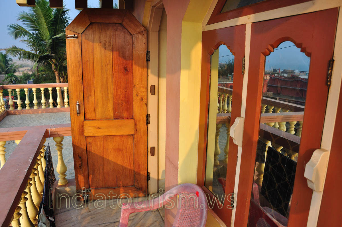 The palms grow near the balcony