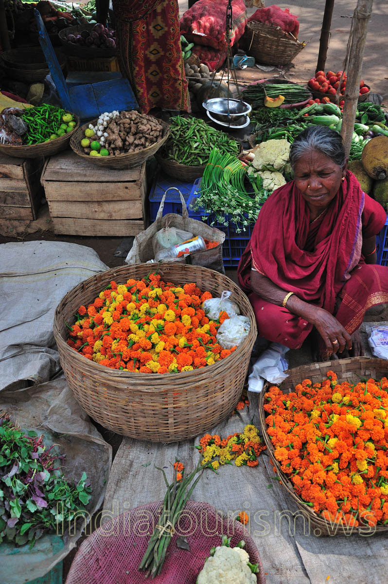 Sale of flowers and vegetables at the market in Puri