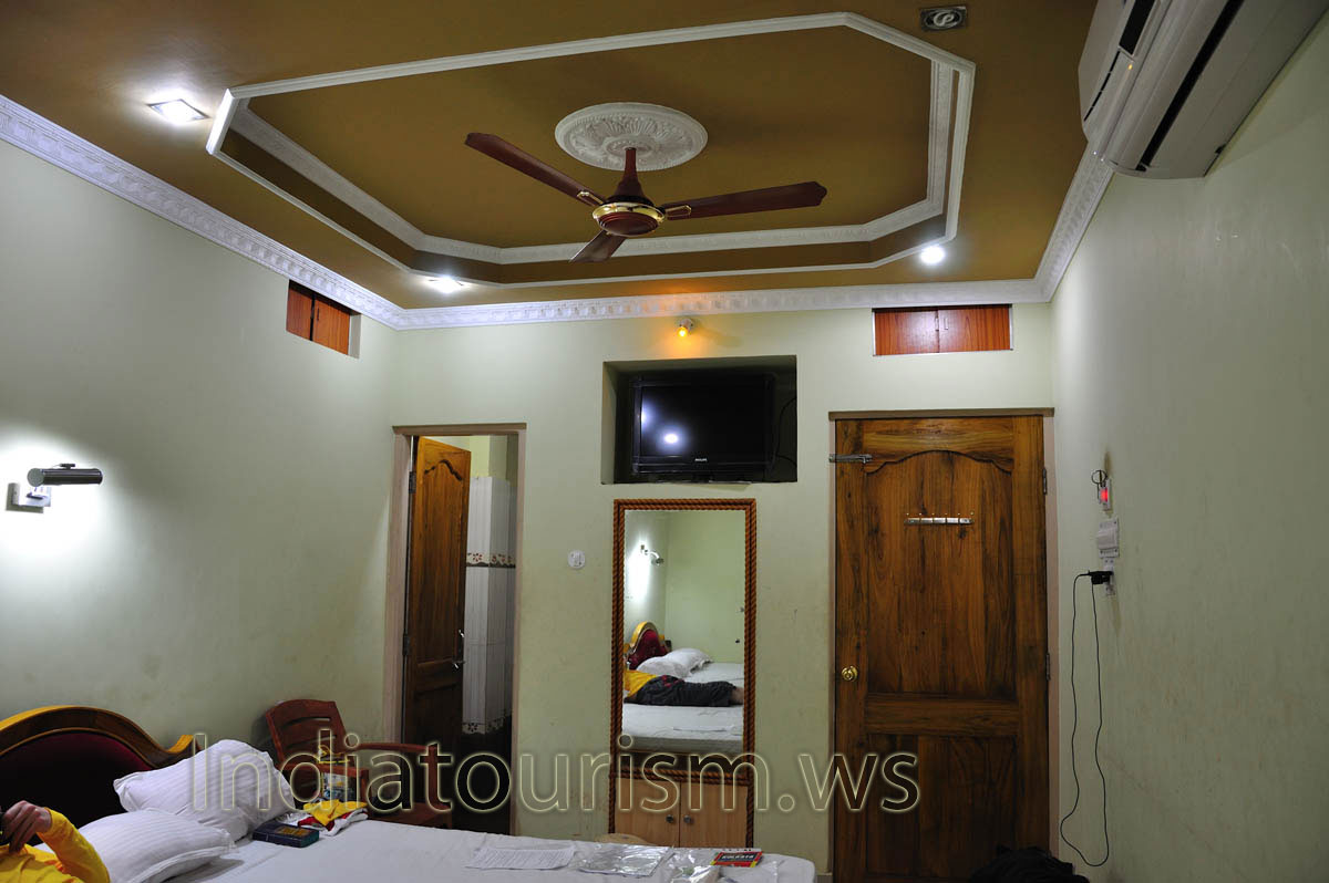 There are the mirror and TV set in the first room