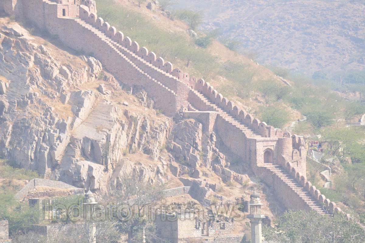 The defensive wall merges with the rock