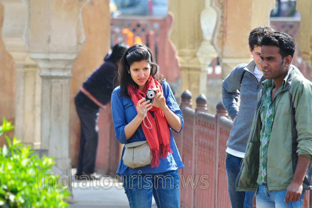 Girl tries to photograph the monkey