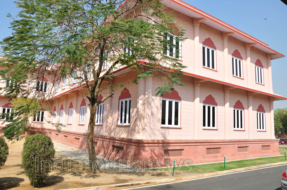 Pink building is found near Birla Planetarium