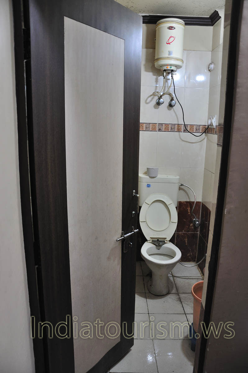 Our shower and toilet room in the Hotel K.K. Palace. There is the boiler with the hot water inside.