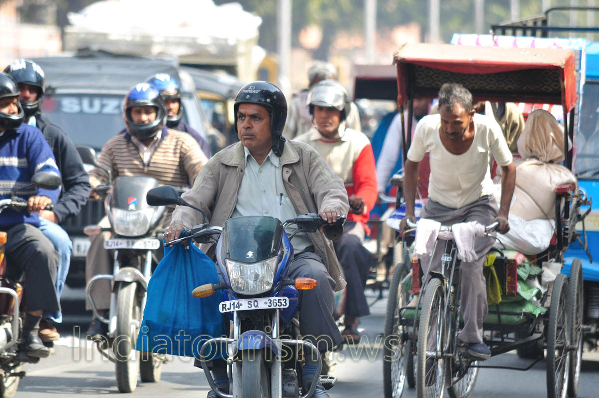 faces of Jaipur: motorcyclist with a bag