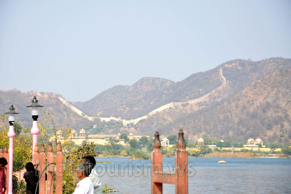 Aravalli hills and the ancient wall are found on the north of Water Palace