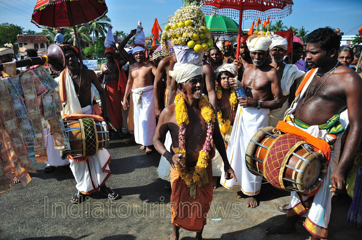 leading dancer strewn with flowers and fruits