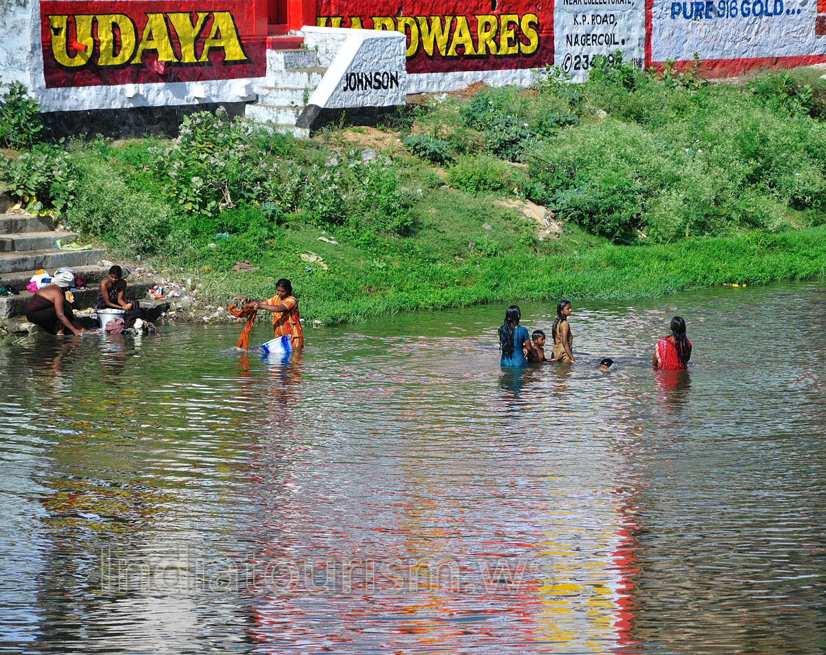 women with the children in the water