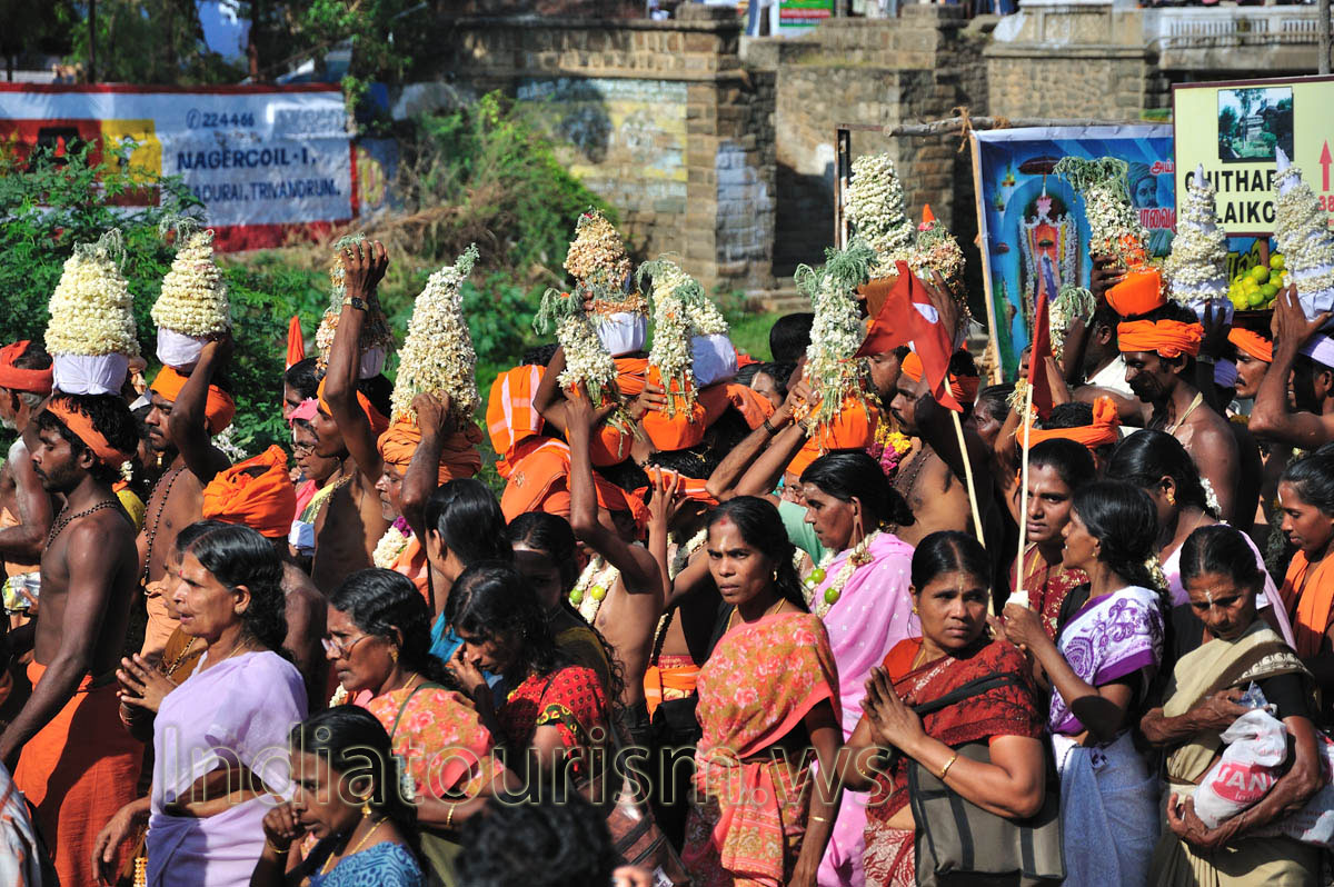 men wear hats of white flowers