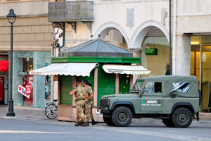 An italian army off-road car parking on the Tre Martiri square