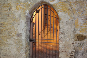 The stairway is behind the closed metal gates inside Castel Sismondo