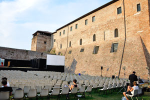 The theater is in the courtyard of Castel Sismondo “Rocca Malatestiana”
