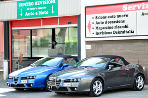 New cars of Alfa Romeo brand are located outdoors beside the salon of the Italian car manufacturer Alfa Romeo