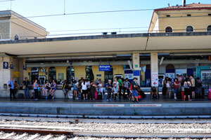 People on the platform of Bologna Centrale railway station