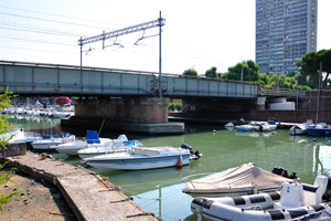 Railway bridge spans over the Port channel of Rimini