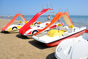 Beach of Rimini is full of catamarans equipped with a water slide