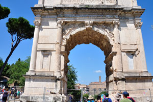 The Arch of Titus is a triumphal arch with a single arched opening