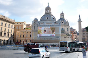 An advertising board is on the Piazza Venezia