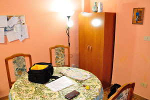 The round table is located close to the entrance door to the apartment