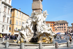 Fountain of the four Rivers with Egyptian obelisk is in the middle of Piazza Navona