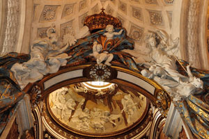 Sculptures of angels are below the ceiling of the church
