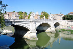 The bridge of Ponte Vittorio Emanuele II crosses the Tiber river