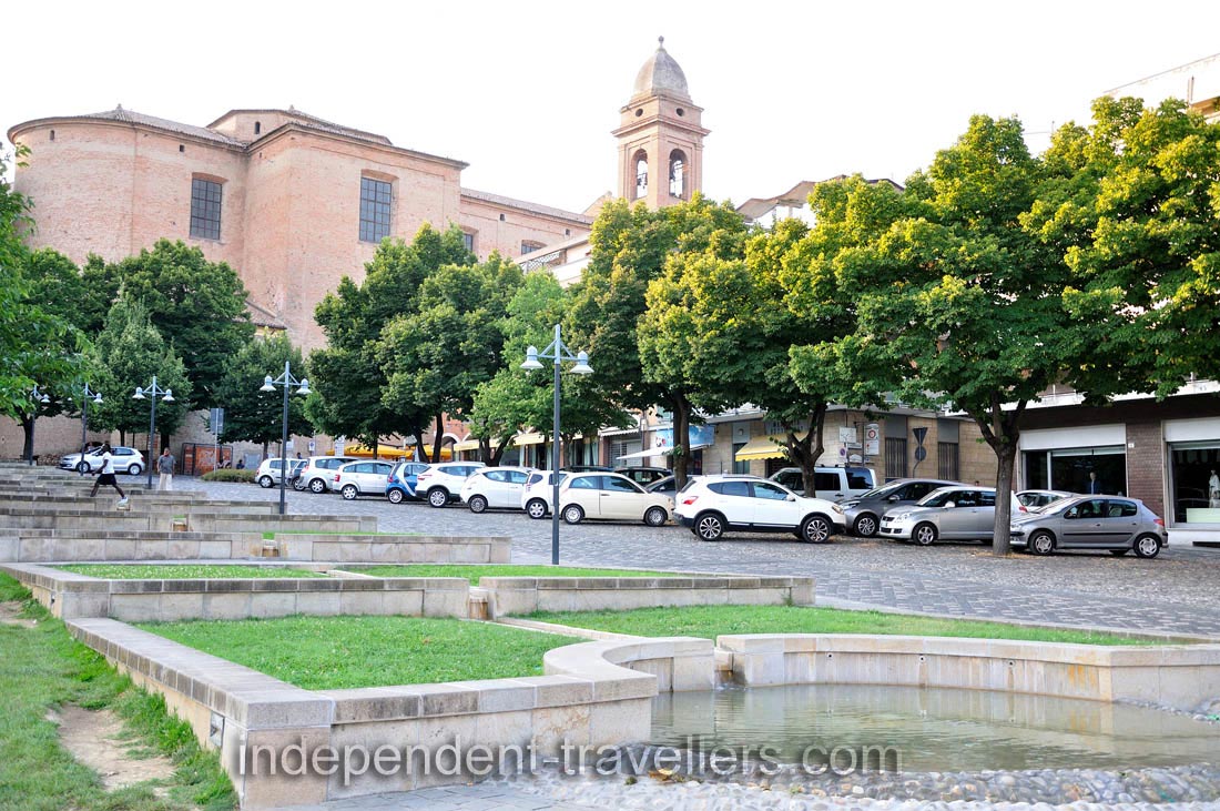 View of the Collegiate church from the fountain of Campo della Fiera park