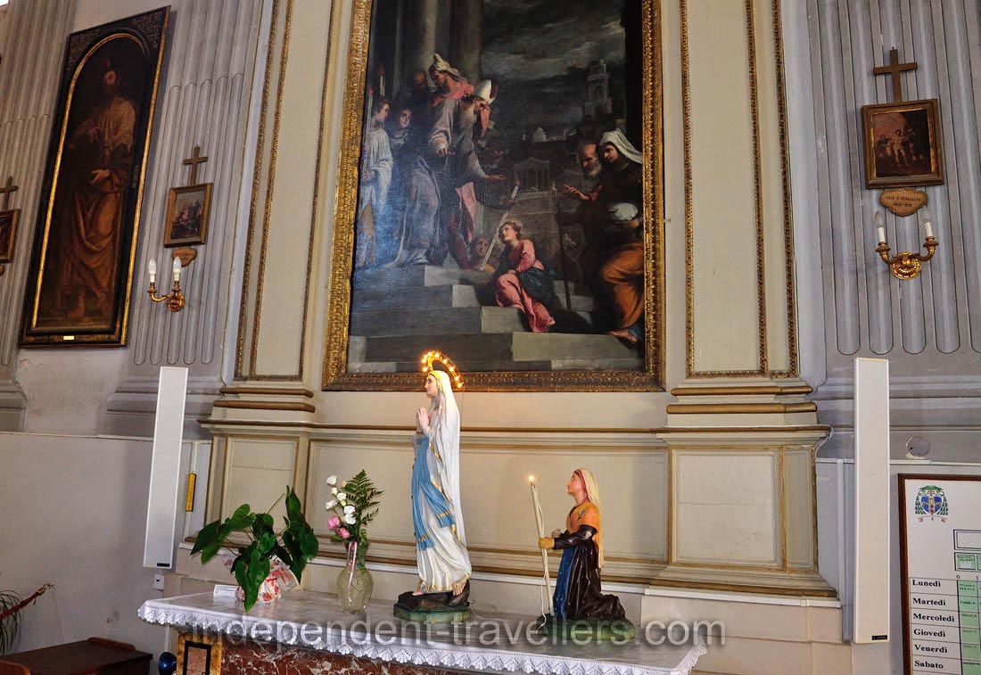 A statuette of Mary is in the catholic church