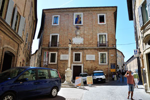 A small city square is on Via Puccinotti street