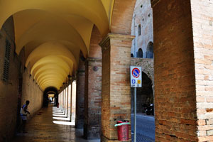 The covered pedestrian sidewalk goes along Corso Giuseppe Garibaldi street