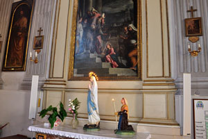 A statuette of Mary is in the catholic church