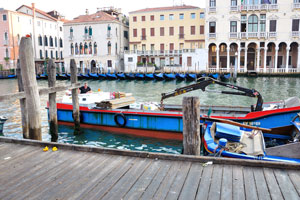 A boat with products has arrived on the Rialto market early in the morning