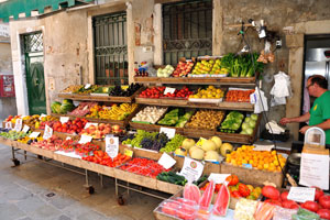 Market stall with the fruits and vegetables near the Santa Maria Formosa church