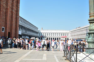 Queue of tourists in the Saint Mark's Basilica in the July morning