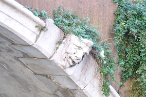 A moss-covered angel is hiding under the Ponte Cavallo bridge