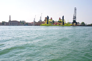 The yellow barge and naval cranes