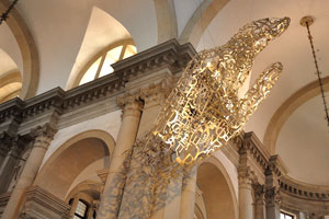 A suspended steel hand floating in the nave in the church of San Giorgio Maggiore