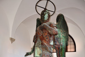 An angel with the strange round hoop above his head inside the bell tower of San Giorgio Maggiore
