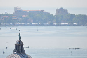 The dome of one of the churches of San Giorgio Maggiore and Lido in the distance