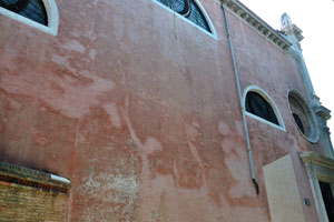 The wall of church of San Rocco from the side of Calle Tintoretto street