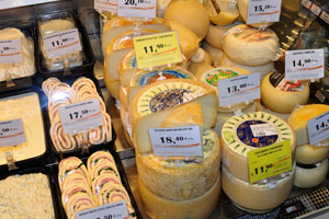 A tasty variety of cheese wheels in the Conad grocery