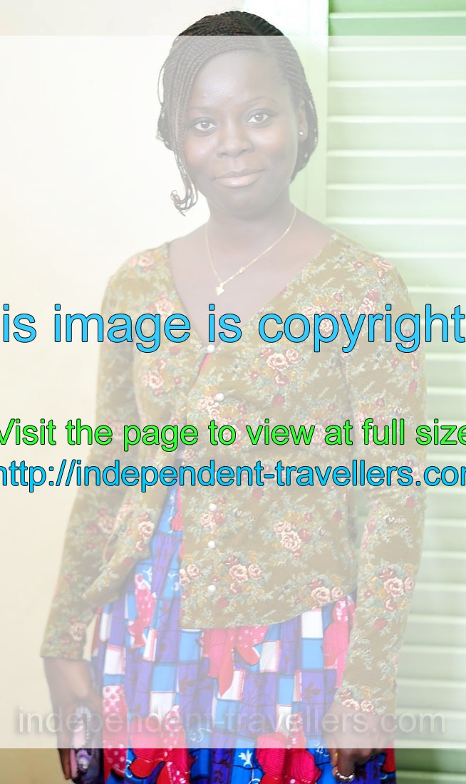 This beautiful Ivorian young woman wears the colourful dress
