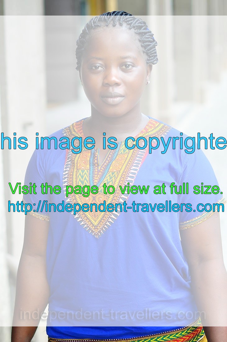 An Ivorian young woman is dressed in the national T-shirt