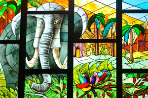 One of the stained glass windows inside Saint Paul's Cathedral depicts an elephant and other animals