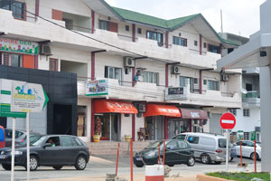 An ordinary three-storey apartment complex is in Cocody